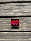 Boucle ovale rouge et violette