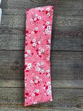 Bandeau élastique fleurs fond rose