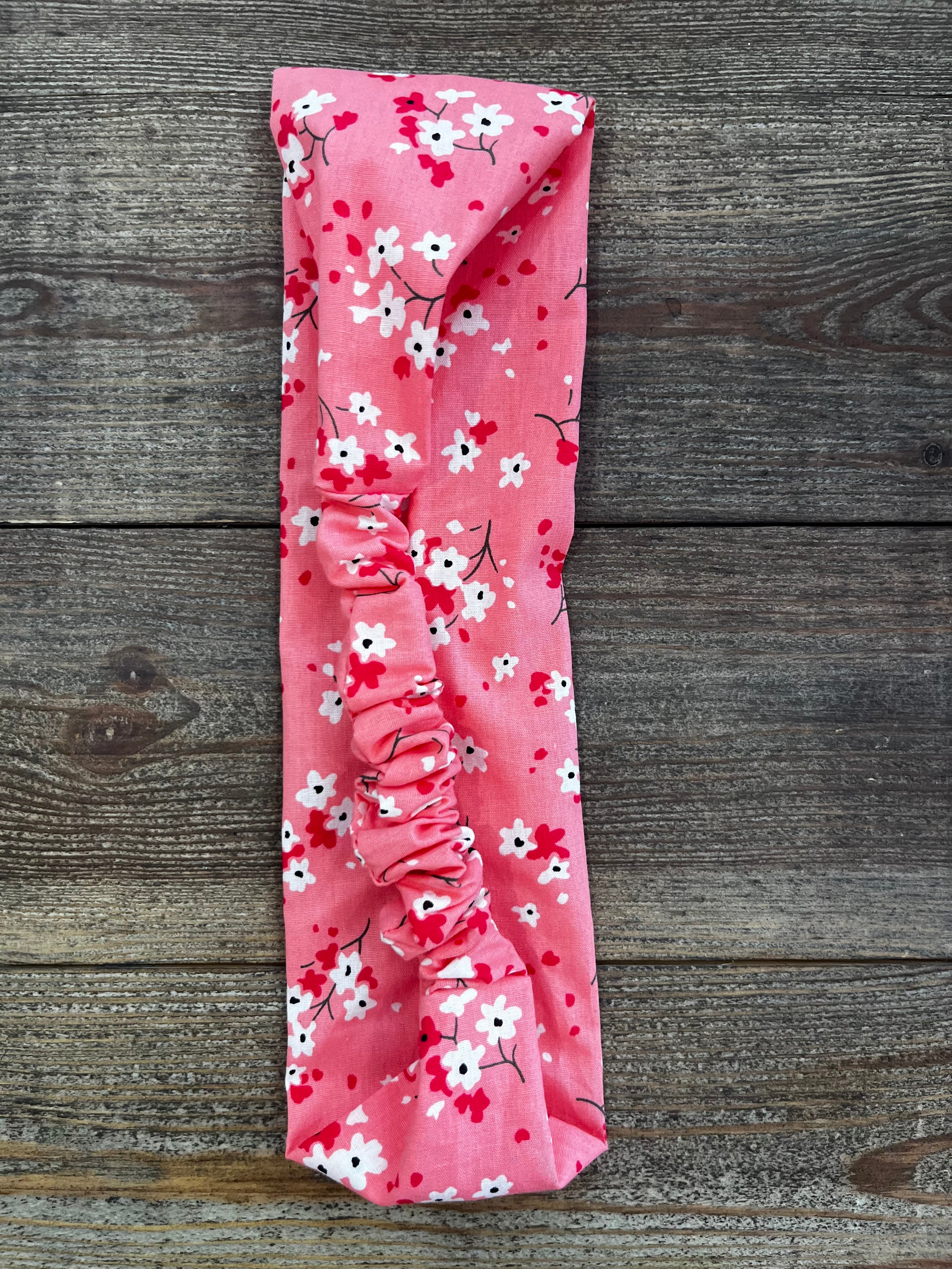 Bandeau élastique fleurs fond rose